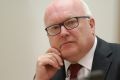 Attorney-General Senator George Brandis during a public hearing before the Legal and Constitutional Affairs References ...