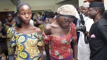 In this photo released by the Nigeria State House, some of the freed Chibok school girls are seen at the state House in ...