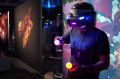 Attendees try out PlayStation VR during a Sony Corp. event ahead of the E3 Electronic Entertainment Expo in Los Angeles, ...