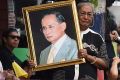 Police officers on duty dressed in black for King Bhumibol Adulyadej's death at the age of 88.