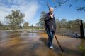 Colin McCormack on his flooded farm in Ovens.