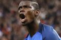 Paul Pogba's celebrates scoring for France.