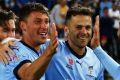 SYDNEY, AUSTRALIA - OCTOBER 08: Filip Holosko of Sydney FC celebrates with team mates after scoring the first goal ...