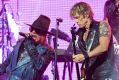 It's going to be more expensive to see artists such as Axl Rose, left, and Duff McKagan of Guns N' Roses, who are ...