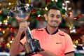 Nick Kyrgios with his third tour trophy of the year in Japan.