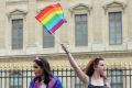 Revelers parade during the annual Gay Pride march in Paris, France in July.