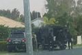 Heavily armed police have surrounded a Morayfield home.