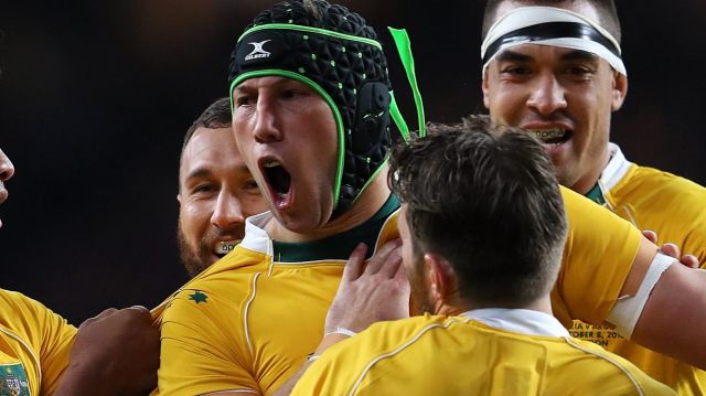 Improver: Adam Coleman celebrates scoring a try against Argentina.