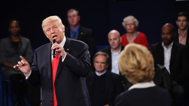 Donald Trump speaks over Democratic presidential nominee Hillary Clinton during the second debate.