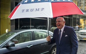 Former New York City mayor Rudy Giuliani leaves Trump Tower in New York on Sunday (AP Photo/Craig Ruttle)