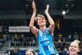 On a high: Jess Bibby is chaired off after her last WNBL game but now has her sights on Australian football.