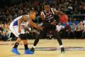 United's Cedric Jackson (right) and Jerome Randle, of the 36ers, contest the ball during their round one game.