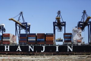 In this Sept. 13, 2016 photo, the container ship Hanjin Boston is unloaded at the Port of Los Angeles. (AP Photo/Reed Saxon)