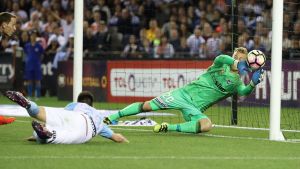 Victory goalkeeper Lawrence Thomas is beaten by a shot from Bruno Fornaroli.