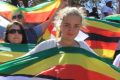 People display flags during the test cricket match between New Zealand and Zimbabwe in Zimbabwe in August.