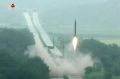 A missile is launched during a drill at an undisclosed location in North Korea. 