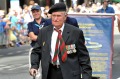 Ex-military soldier Graham Tweedale gets out of his wheelchair to march on Anzac Day 2016.