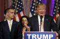 Donald Trump's campaign manager Corey Lewandowski listens at left as Trump speaks in Florida.