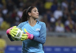 United States goalkeeper Hope Solo takes the ball during a women's Olympic football tournament match against New Zealand at the Mineirao stadium in Belo Horizonte, Brazil