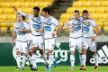 Victory players celebrate Besart Berisha's goal.