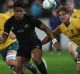 Black spot: All Black Julian Savea gets the ball away against the Wallabies in Wellington in August. 