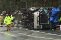 The scene of the accident involving two trucks and a car towing a caravan on the Pacific Highway near Taree on Thursday.