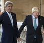 US Secretary of State John Kerry, left, waves as he is greeted by British Foreign Secretary Boris Johnson ahead of a meeting on the situation in Syria,  at Lancaster House in London, Sunday Oct. 16, 2016.  Renewing the international effort to solve the conflict in Syria, heightened by the plight of people in the city of Aleppo, have made little progress but more talks are planned. ( JUSTIN TALLIS / Pool via AP)