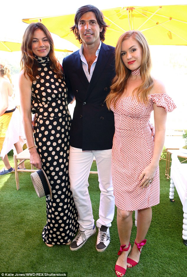 Lucky guy! Here Nacho Figueras is flanked by Michelle and Isla