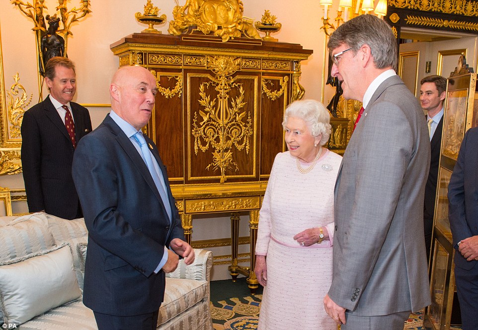 Queen Elizabeth meets Red Cross Executive Director of Fundraising Mark Astarita (left) and Red Cross Chief Executive Michael Adamson (right)