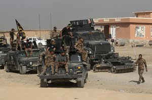 Iraq's elite counterterrorism forces gather ahead of an operation to re-take the Islamic State-held City of Mosul, outside Irbil, Iraq, Saturday, Oct. 15, 2016.