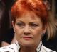 Senator Pauline Hanson enters the House of Represenatives for the address of Prime Minister of Singapore Lee Hsien Loong ...