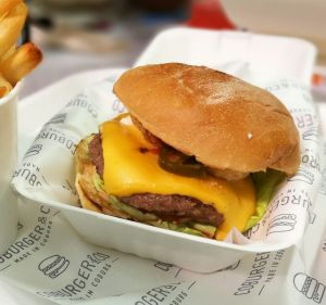 Coburger & Co's 'Lip Popper' wagyu burger with battered jalapeno, cheese, lettuce, tomato, pickles, chipotle mayo and ...