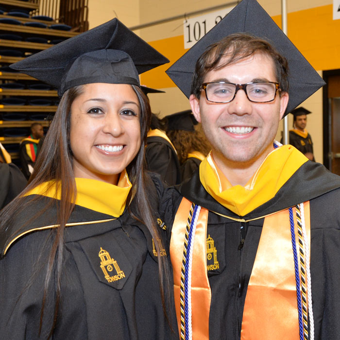 A female and male student at Commencement