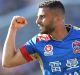 Star turn: Andrew Nabbout celebrates after scoring against the Roar at Hunter Stadium.