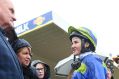 Quick chat: Jockey Michelle Payne with Queen of Zealand's owner Colin McKenna.