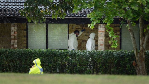 Staff at the children's school raised the alarm when the mother did not turn up for canteen duty and the children were ...