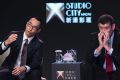 Melco Crown Entertainment co-chairman and chief executive officer Lawrence Ho, left, speaks as James Packer listens.