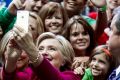 Democratic presidential candidate Hillary Clinton takes a selfie with supporters at a campaign rally at the Zembo Shrine ...