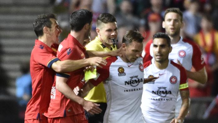 Adelaide players protest against umpire decision regarding Brendon Santalab (middle) of the Wanderers during the Round 2 A-League match between Adelaide United and the Western Sydney Wanderers at Cooper Stadium in Adelaide, Friday, Oct. 14, 2016. (AAP Image/David Mariuz) NO ARCHIVING, EDITORIAL USE ONLY