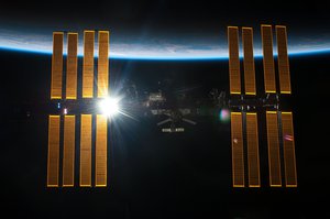 File - Backdropped by the blackness of space and Earth's horizon, the International Space Station is featured in this image photographed by an STS-134 crew member on the space shuttle Endeavour after the station and shuttle began their post-undocking relative separation, 29 May, 2011.