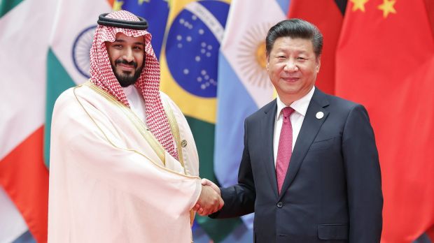 Among the powerful: Chinese President Xi Jinping (right) shakes hands with Saudi Arabian Deputy Crown Prince Mohammed ...