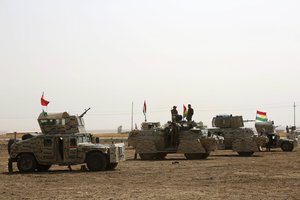 A peshmerga convoy drives towards a frontline in Khazer, about 30 kilometers (19 miles) east of Mosul, Iraq, Monday, Oct. 17, 2016.