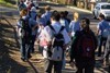 Qld high school kids walking along a street in Brisbane.