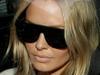 Lara Bingle leaves the Sydney apartment she shares with Michael Clarke - 
    without her engagement ring. Picture: Adam Ward