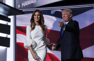 Melania Trump, wife of Republican Presidential Candidate Donald Trump walks to the stage as Donald Trump introduces her during the opening day of the Republican National Convention in Cleveland, Monday, July 18, 2016.  (AP Photo/Carolyn Kaster)