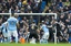 Leicester City's Robert Huth, right, scores his second goal during the English Premier League soccer match between Manchester City and Leicester City at the Etihad Stadium in Manchester, England