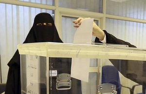 Saudi women vote at a polling center during the municipal elections, in Riyadh, Saudi Arabia, Saturday, Dec. 12, 2015.