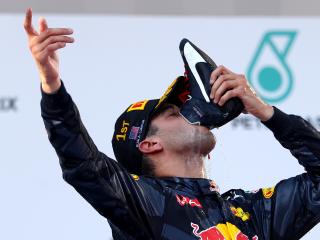 KUALA LUMPUR, MALAYSIA - OCTOBER 02: Daniel Ricciardo of Australia and Red Bull Racing celebrates his win on the podium during the Malaysia Formula One Grand Prix at Sepang Circuit on October 2, 2016 in Kuala Lumpur, Malaysia. (Photo by Clive Rose/Getty Images)