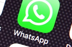 The Whatsapp app logo on an iPhone. 