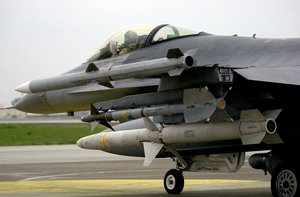 US Air Force (USAF) F-16C Fighting Falcon aircraft assigned to the 23rd Fighter Squadron (FS), armed with AIM-120 Advanced Medium Range Air-to-Air Missiles (AMRAAM), AIM-9 Sidewinder missiles and AGM-88 High Speed Antiradiation Missile (HARM) taxies onto the flight line at Incirlik Air Base (AB), Turkey, for a mission in support of Operation NORTHERN WATCH.